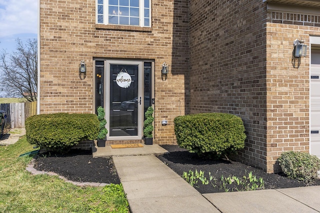 entrance to property with brick siding