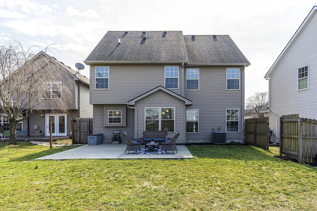 rear view of house with a patio, fence, roof with shingles, a yard, and central air condition unit