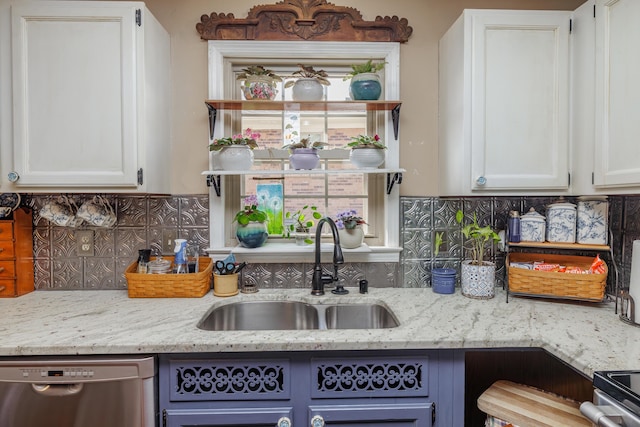 kitchen with a sink, decorative backsplash, dishwasher, and white cabinets