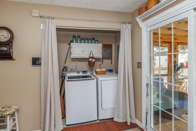 clothes washing area featuring wood finished floors, cabinet space, independent washer and dryer, and a textured ceiling