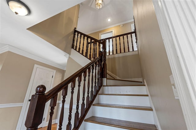 staircase with recessed lighting, baseboards, and crown molding