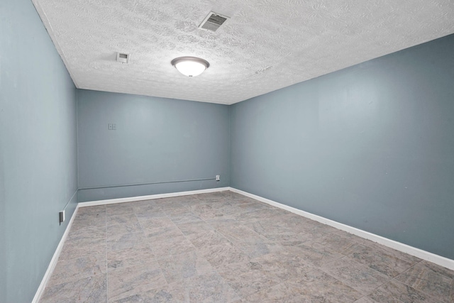 empty room featuring visible vents and baseboards