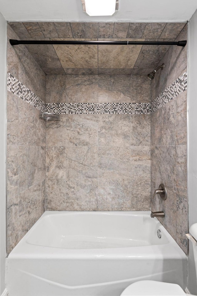 full bathroom featuring visible vents, toilet, and bathing tub / shower combination