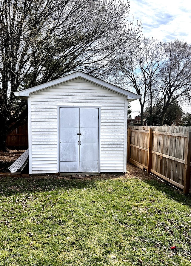 view of shed with fence