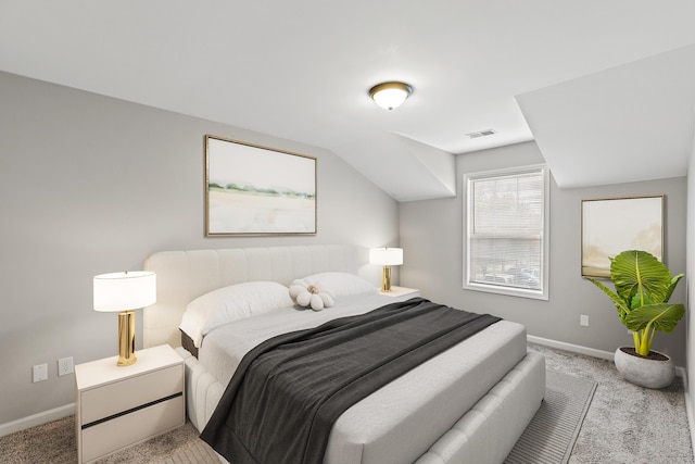 carpeted bedroom featuring visible vents, baseboards, and lofted ceiling