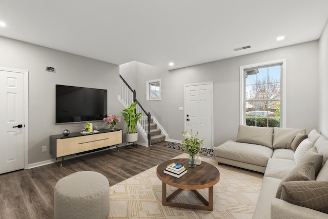 living room with recessed lighting, stairway, visible vents, and wood finished floors