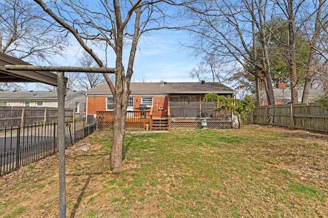 view of yard featuring central air condition unit, a wooden deck, a fenced backyard, and a sunroom