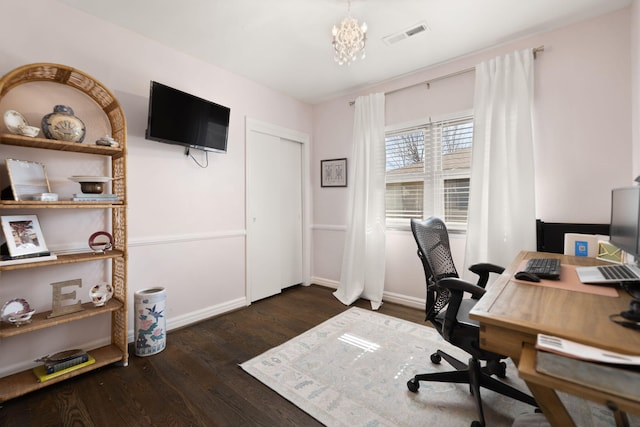 home office featuring wood finished floors, visible vents, and baseboards