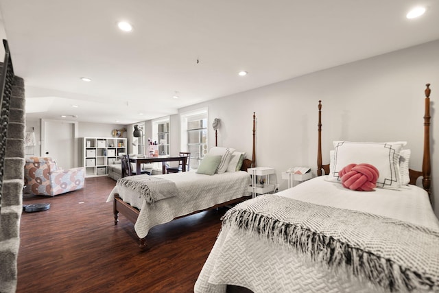 bedroom with recessed lighting and wood finished floors