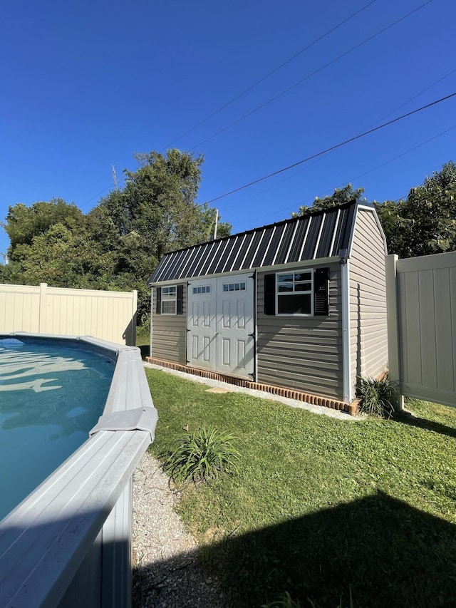 view of shed with a fenced backyard