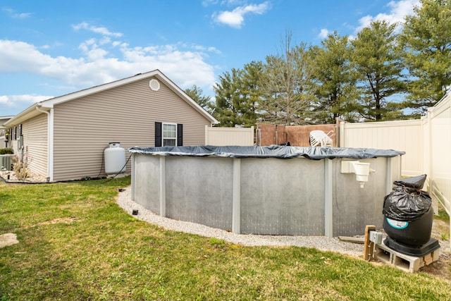 exterior space featuring a lawn and fence