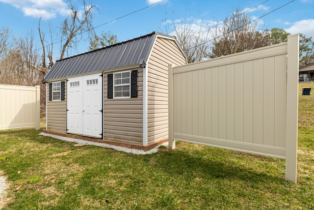 view of shed featuring fence