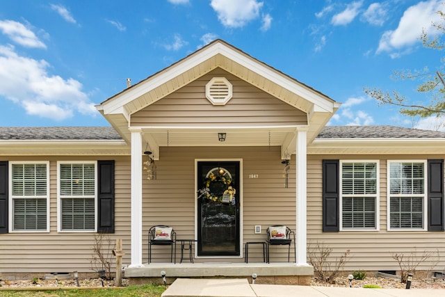 doorway to property featuring crawl space and covered porch