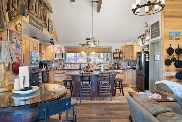 kitchen with an inviting chandelier, open shelves, freestanding refrigerator, and light brown cabinetry