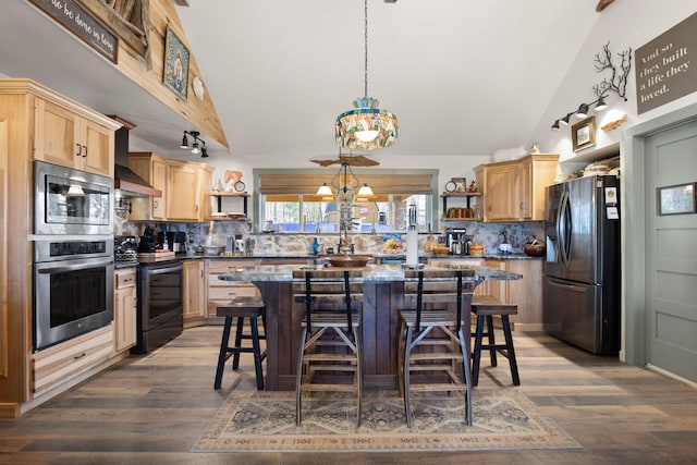 kitchen with vaulted ceiling, light brown cabinets, stainless steel appliances, and open shelves