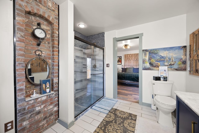 full bathroom featuring vanity, a stall shower, tile patterned floors, toilet, and connected bathroom