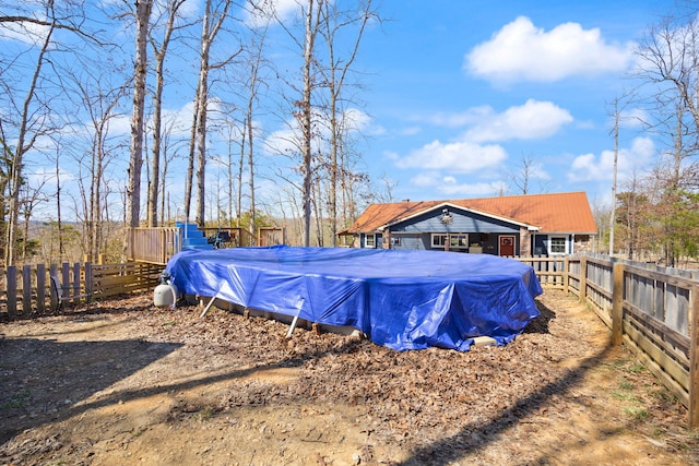 view of yard featuring a fenced in pool and a fenced backyard