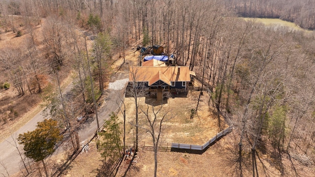 birds eye view of property with a forest view