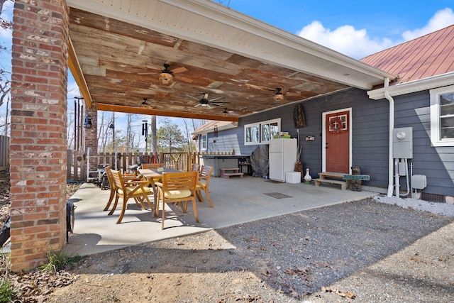 view of patio / terrace featuring outdoor dining area, a ceiling fan, and fence