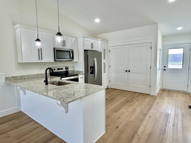 1403 Kit Cowan Rd, Somerset, KY 42503 - kitchen with light wood finished floors, stainless steel appliances, white cabinets, and a sink