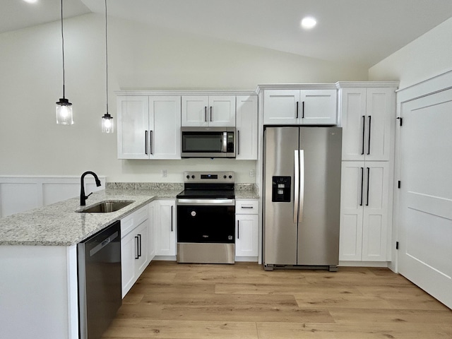 1403 Kit Cowan Rd, Somerset, KY 42503 - kitchen with white cabinets, a sink, stainless steel appliances, light wood-type flooring, and light stone countertops
