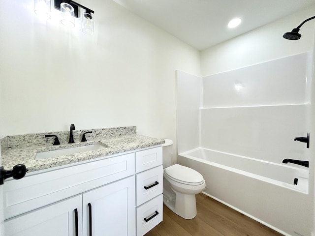 1403 Kit Cowan Rd, Somerset, KY 42503 - bathroom with toilet, vanity, tub / shower combination, and wood finished floors