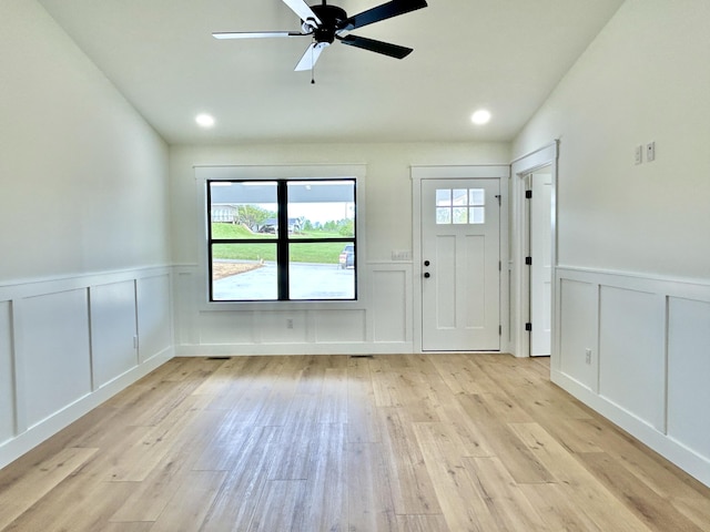 1403 Kit Cowan Rd, Somerset, KY 42503 - foyer with light wood finished floors, a ceiling fan, wainscoting, and a decorative wall