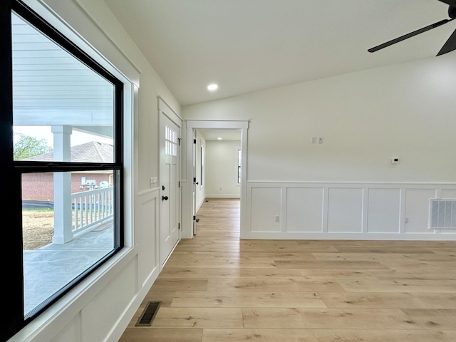 1403 Kit Cowan Rd, Somerset, KY 42503 - hall with lofted ceiling, visible vents, light wood-type flooring, and a decorative wall