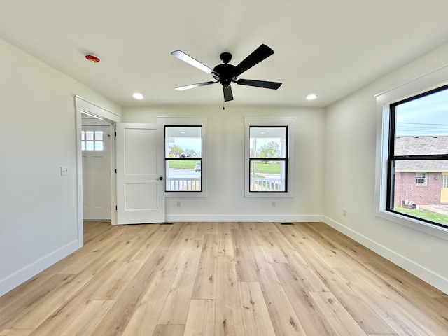 1403 Kit Cowan Rd, Somerset, KY 42503 - spare room with light wood-type flooring, ceiling fan, a wealth of natural light, and baseboards