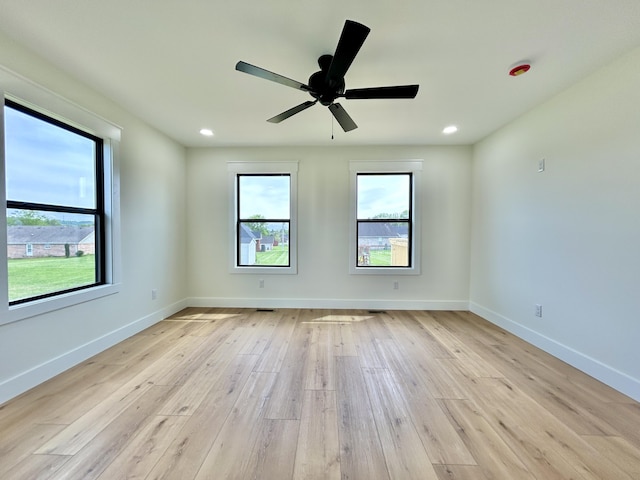1403 Kit Cowan Rd, Somerset, KY 42503 - empty room with baseboards, recessed lighting, a healthy amount of sunlight, and light wood-style floors