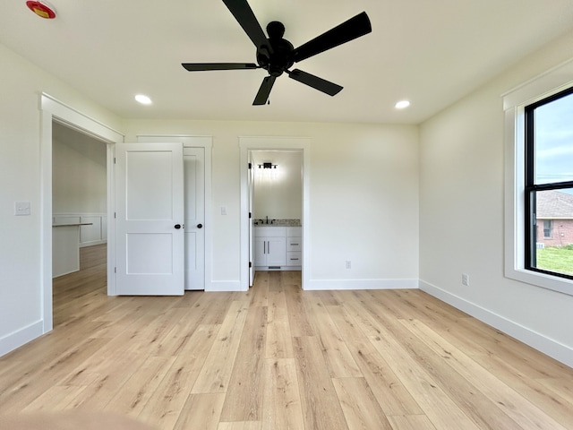 1403 Kit Cowan Rd, Somerset, KY 42503 - unfurnished bedroom with light wood-style floors, baseboards, and multiple windows