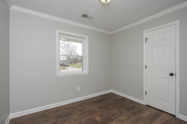 unfurnished room featuring visible vents, baseboards, dark wood-style flooring, a textured ceiling, and crown molding