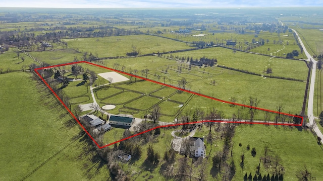 birds eye view of property featuring a rural view