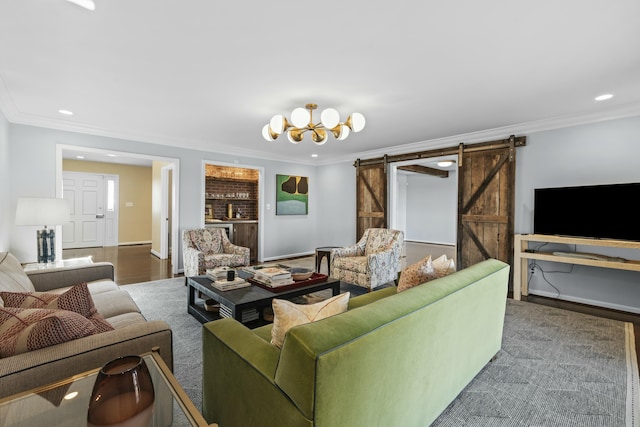 living room with wood finished floors, baseboards, recessed lighting, ornamental molding, and a barn door