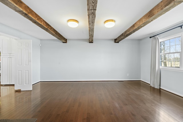 interior space with baseboards and dark wood finished floors