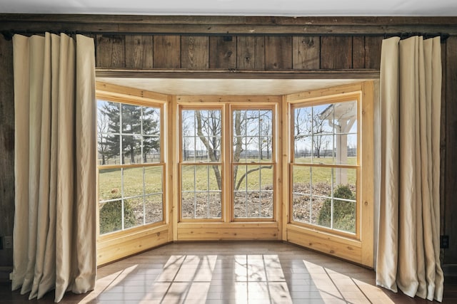 unfurnished sunroom featuring plenty of natural light