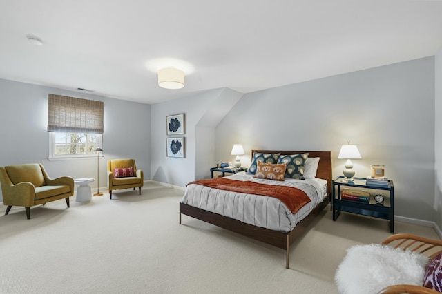 carpeted bedroom featuring baseboards and visible vents