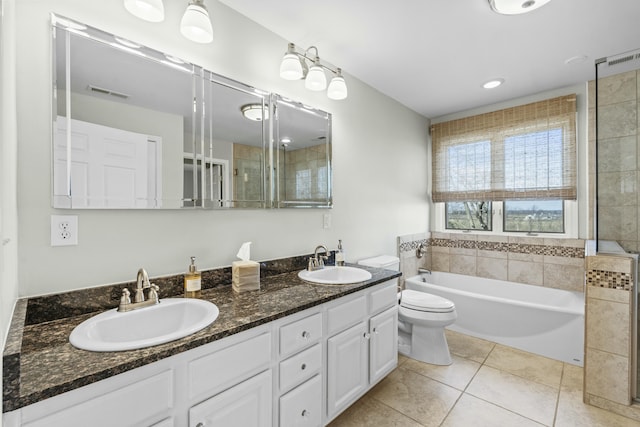 bathroom featuring a sink, visible vents, a garden tub, and tile patterned flooring