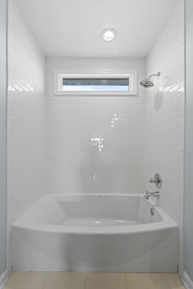 full bathroom featuring tile patterned floors and shower / tub combination