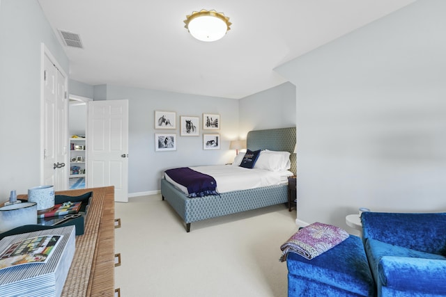 bedroom with baseboards, carpet floors, and visible vents