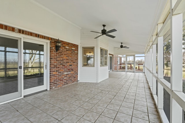 unfurnished sunroom with lofted ceiling and ceiling fan