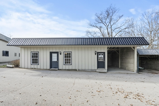 view of outbuilding featuring a carport