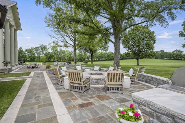 view of patio / terrace with an outdoor fire pit