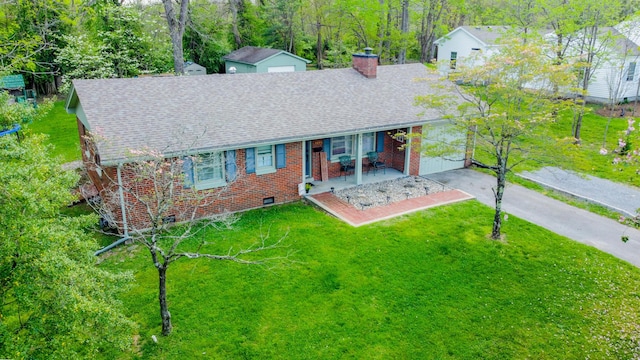212 Williamsburg Ct, Danville, KY 40422 - view of front of house with a front lawn, roof with shingles, a chimney, brick siding, and a porch