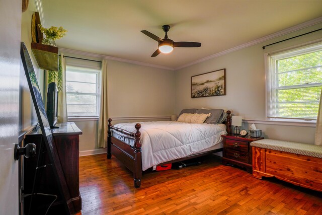 212 Williamsburg Ct, Danville, KY 40422 - bedroom with ornamental molding, ceiling fan, multiple windows, and wood finished floors