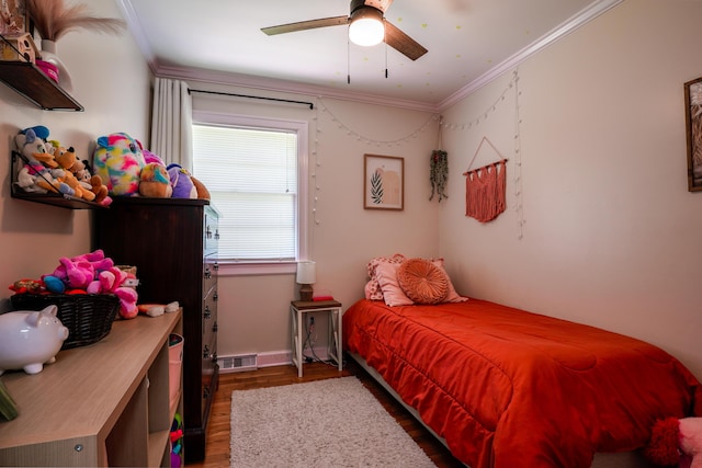 212 Williamsburg Ct, Danville, KY 40422 - bedroom featuring a ceiling fan, baseboards, wood finished floors, visible vents, and ornamental molding