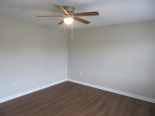 unfurnished room featuring ceiling fan, baseboards, and dark wood-style flooring