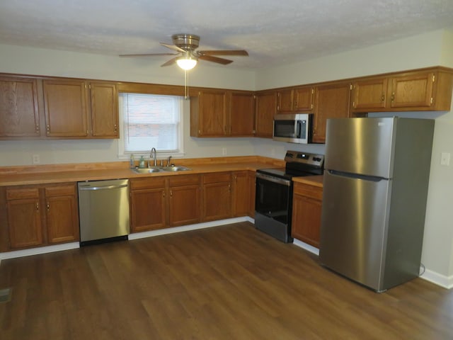 kitchen featuring a sink, brown cabinets, and appliances with stainless steel finishes