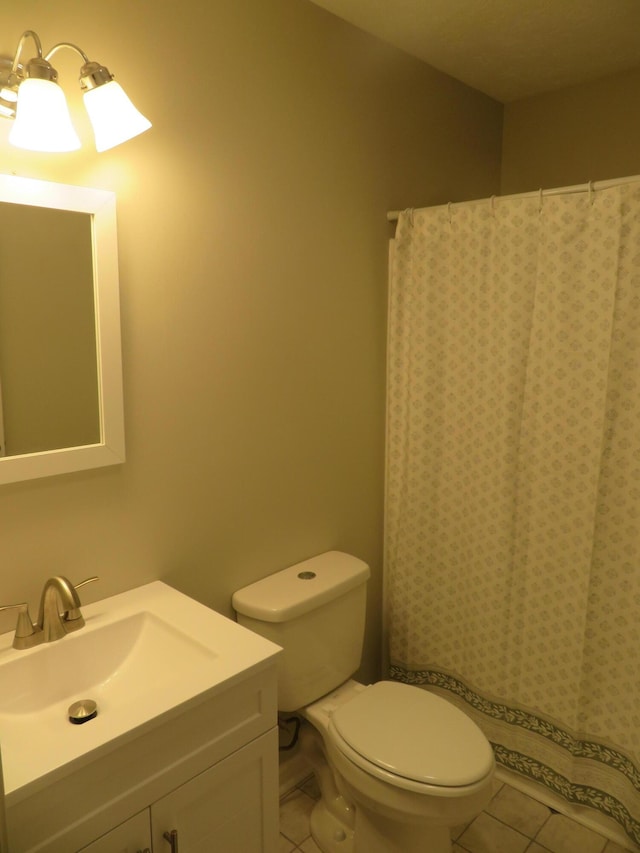 full bath featuring tile patterned floors, toilet, and vanity