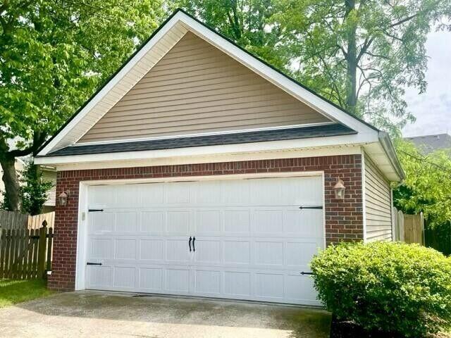 garage featuring fence